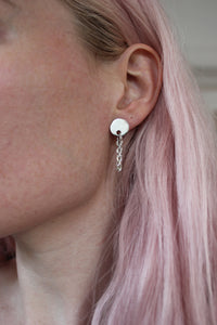 Drop chain earrings and pink hair