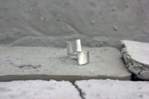 Handmade sustainable adjustable ring. product picture on concrete