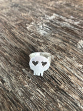 minimal designer skull ring with heart eyes made in recycled sterling silver